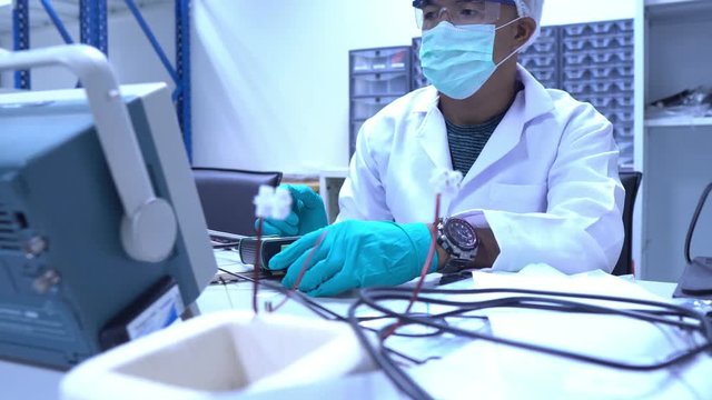 Scientist working in the lab,Highly skilled scientists and engineers are in a position to check the operation of the new project.