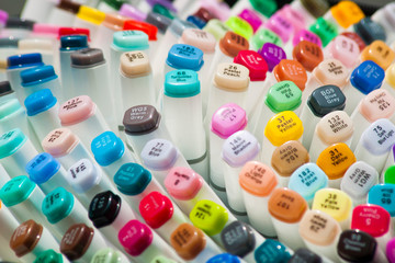 Many multicolored markers. A set of markers with inscriptions of their colors