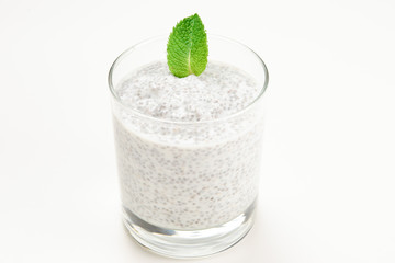 Chia pudding with mint on a white background. Space for text or design.