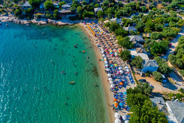 Fototapeta premium Aerial View of the Aliki Beach with colorful umbrellas, at Thassos island, Greece
