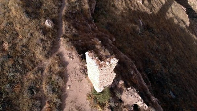 Judean Desert Wadi Tekoa. The remains of the monks caves and the ruins of the monastery of St. Hariton. Israel. Village Tekoa. View from the drone.