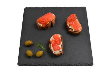 Salmon on a bread with cream isolated on white.