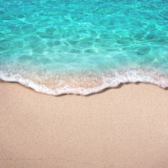Naklejka na ściany i meble Soft blue ocean wave or clear sea on clean sandy beach summer concept