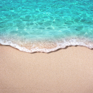 Soft blue ocean wave or clear sea on clean sandy beach summer concept © OHishi_Foto