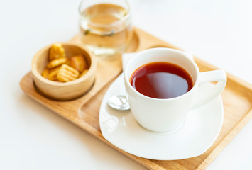 Hot tea on wooden tray