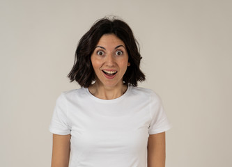 Fototapeta premium Portrait of surprised and happy woman feeling enthusiastic about good news or winning