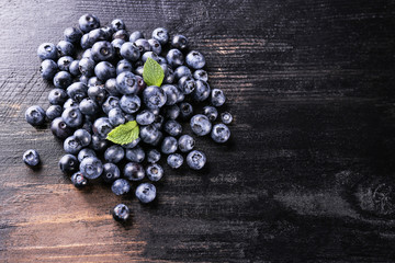 Perfectly ripe freshly picked local produce blueberries. Close up, copy space for text, top view, background. Healthy vegan snacks full of antioxidants. Seasonal summer berries.