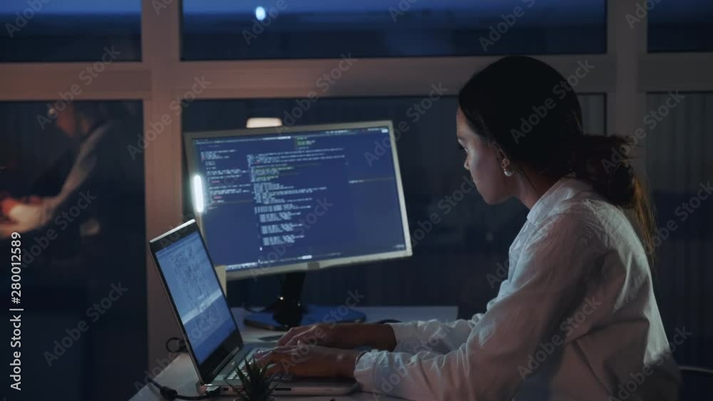 Wall mural side view of african american female engineer working on computer in electronics laboratory. doing d