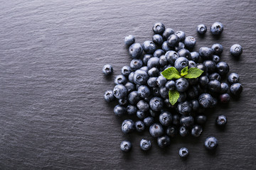Perfectly ripe freshly picked local produce blueberries. Close up, copy space for text, top view, background. Healthy vegan snacks full of antioxidants. Seasonal summer berries.