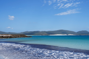Fototapeta na wymiar Beatiful beach in Sardinia with clear blue sky and turquoise blue water