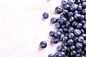 Perfectly ripe freshly picked local produce blueberries. Close up, copy space for text, top view, background. Healthy vegan snacks full of antioxidants. Seasonal summer berries.