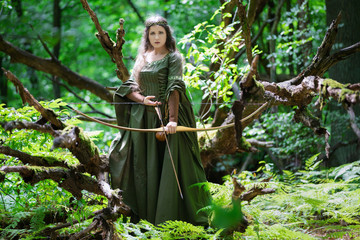 Elf archer with a bow in the forest