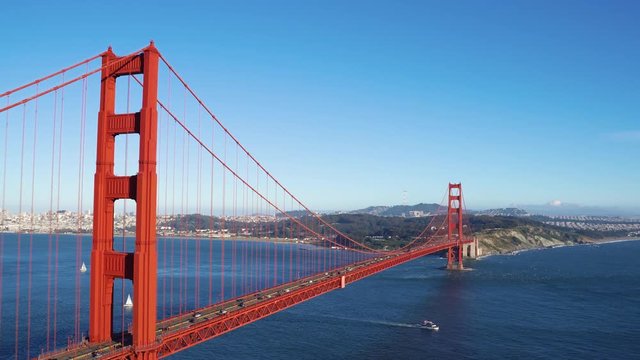 Golden Gate Bridge aerial view San Francisco California State. beautiful amazing nature mountain by busy city urban area on summer. blue sky and clear ocean sea water with red iron bridge traffic.