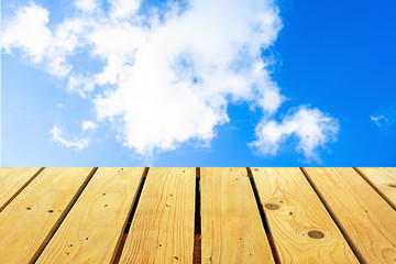 The blur cool blue sky white cloud with old Wooden table