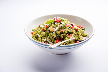 Hariyali Poha / Green Masala Pohe or flattened rice served in a bowl, selective focus