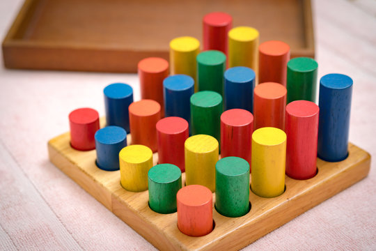 Closeup of colorful wooden Montessori sensorial material learning, Sizing and order block. Kindergarten educational toys, Thinking process, Cognitive skills, Learn Through Play tools concept.