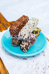Chocolate energy protein bars with nuts, seeds, dry fruits. Healthy dietary snack. Vegan dessert. Chia, flax seeds, coconut, sesame, pumpkin, sunflower seeds.