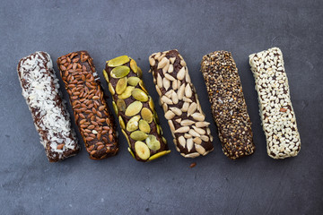 Chocolate energy protein bars with nuts, seeds, dry fruits. Healthy dietary snack. Vegan dessert....