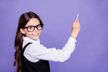 Close-up portrait of nice attractive smart clever intellectual diligent cheerful wavy-haired pre-teen girl writing example copy space class work isolated over bright vivid shine violet background