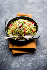 Hariyali Poha / Green Masala Pohe or flattened rice served in a bowl, selective focus