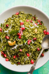 Hariyali Poha / Green Masala Pohe or flattened rice served in a bowl, selective focus