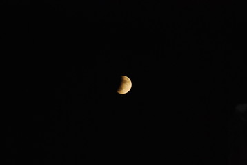 Orange Moon in Black Sky