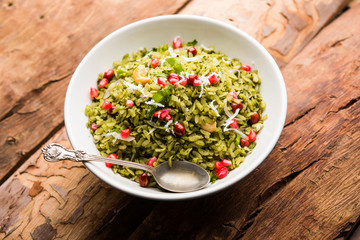 Hariyali Poha / Green Masala Pohe or flattened rice served in a bowl, selective focus