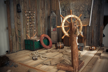 The interior of an old wooden ship. Treasure Chest, Vintage Map, Old Lifebuoy, Ship Rope, Wooden Barrel