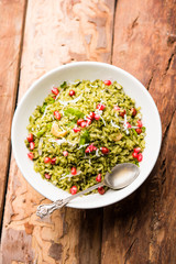 Hariyali Poha / Green Masala Pohe or flattened rice served in a bowl, selective focus