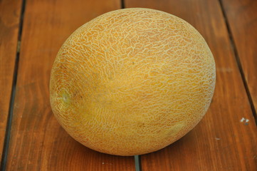 ripe melon on wooden table