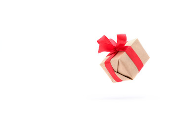 Gift box with red ribbon isolated on white background. levitation. milimalism. copyspace. Concept sales, shopping, christmas holidays and birthday