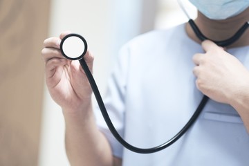 The doctor used the white stethoscope for the physical examination of the patients in the hospital.