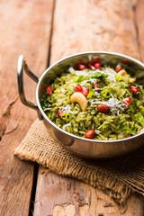 Hariyali Poha / Green Masala Pohe or flattened rice served in a bowl, selective focus
