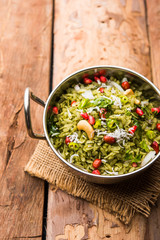 Hariyali Poha / Green Masala Pohe or flattened rice served in a bowl, selective focus