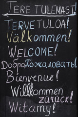 Black board with chalk script saying 