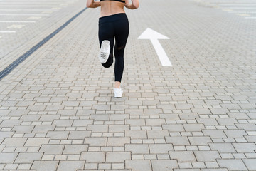 Sport woman running forward