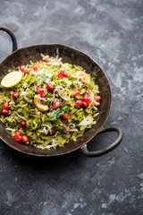 Hariyali Poha / Green Masala Pohe or flattened rice served in a bowl, selective focus
