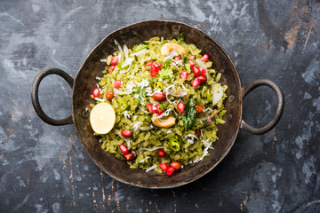 Hariyali Poha / Green Masala Pohe or flattened rice served in a bowl, selective focus