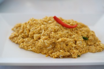 Fried crab meat with curry powder close up