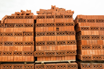 stacked bricks at a construction site for laying walls, at a construction site