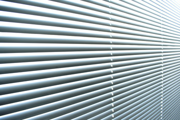 Obraz premium Closed metal blinds, sunlight reflection