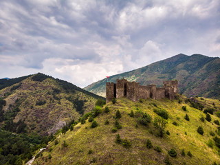 Obraz premium Ruins of medieval fortress Maglic on top of hill by the Ibar river in Serbia. Aerial view. Valley of this river is also called Lilac valley.