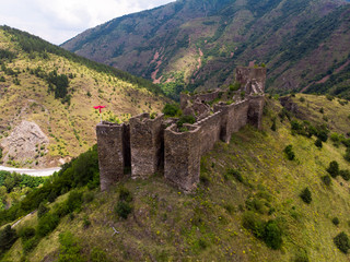 Ruins of medieval fortress Maglic on top of hill by the Ibar river in Serbia. Aerial view. Valley of this river is also called Lilac valley.