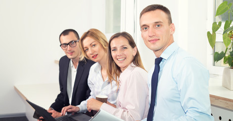 Group of smiling business people in the office.