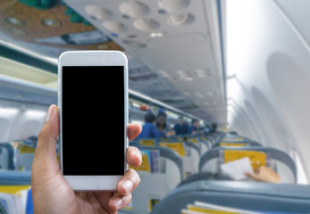 Man use your phone in airplane blurred background