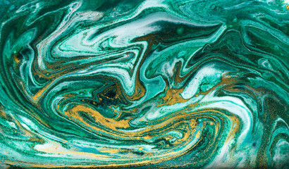 Green and gold marbling pattern. Golden powder marble liquid texture.