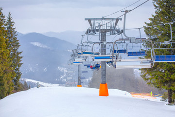 People on ski lift in the winter 