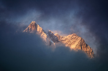 Beautiful sunset red colored view of Lhotse with beautiful clouds, Khumbu valley, Nepal