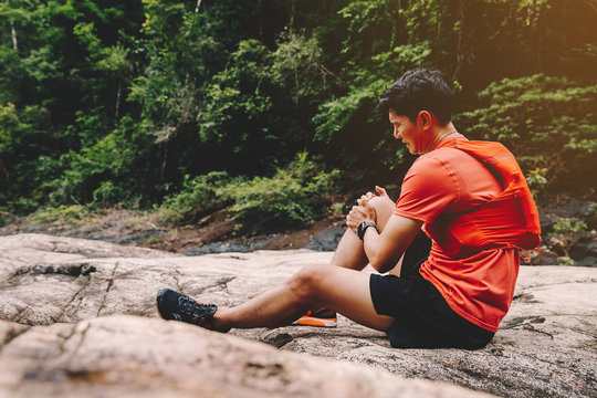 Runners. Young people  trail running on a mountain path. Adventure trail running on a mountain. Runners receive injuries from running trails on a mountain