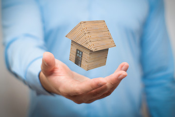hand holding home, house, property, realestate